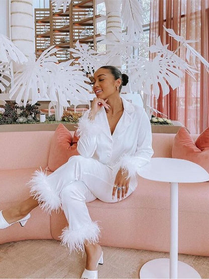 Conjunto de dos piezas con plumas